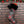 Plaid Christmas stocking with Harley-Davidson logo on a brick wall background