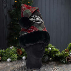 Plaid Santa hat with Harley-Davidson logo on a mannequin head against a Christmas-themed background.