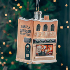 Harley Davidson-themed ornament with a building design on a Christmas tree background