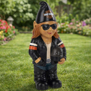 Gnome wearing a Harley-Davidson cap and leather jacket holding a helmet on grass