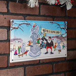 A rectangular metal wall sign featuring a colorful winter holiday illustration, mounted on a red brick wall. The sign depicts Santa Claus, children, and a sculpture in a snowy scene, with the text 'Santa Pole Ice Sculpture Contest' and 'Harley-Davidson' visible on the artwork.