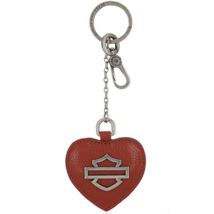 Red heart-shaped keychain with a silver logo on a white background