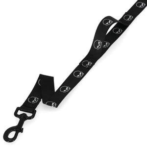 A black dog leash with a repeating white skull and crossbones pattern, featuring a black metal snap hook clasp on one end, shown against a plain white background.