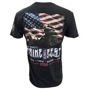 Black short-sleeve graphic t-shirt showing the back print with an American flag, a motorcycle, and 'Ride Fest 2026' text.